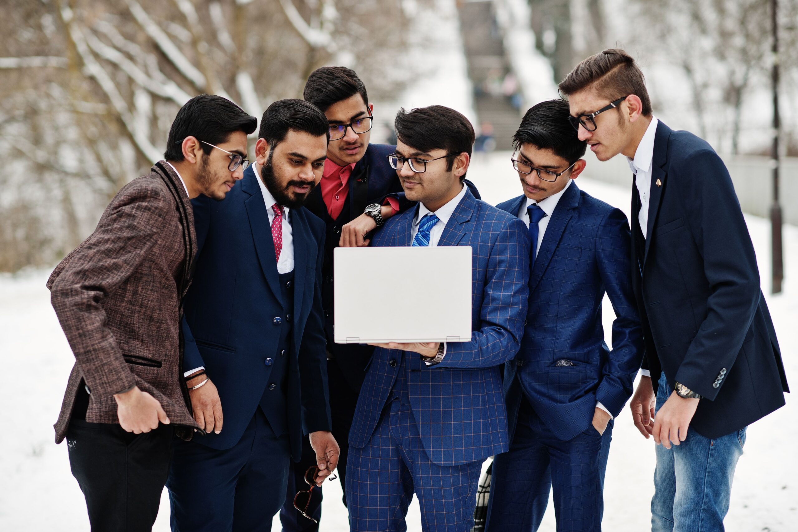 Young Indian businessmen analyzing GDP forecast and investment returns with currency symbols india economy