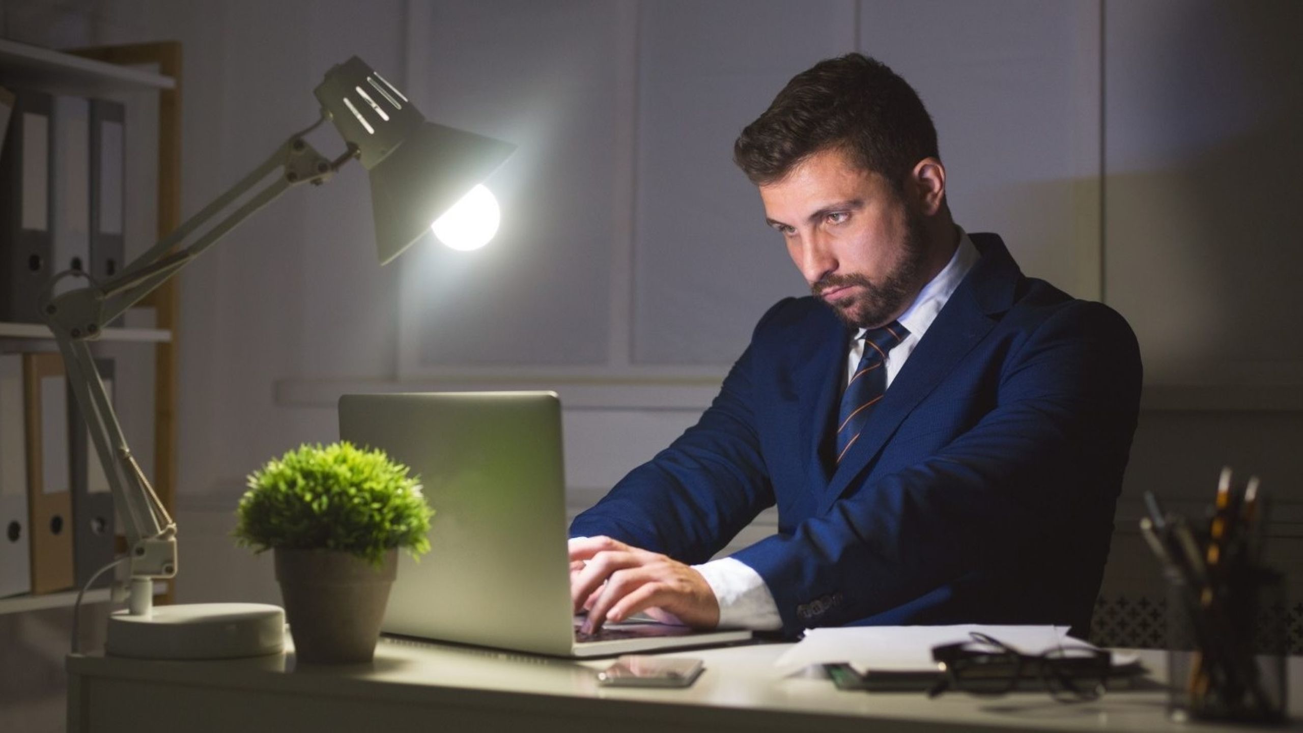 Indian professional building side hustle business on laptop while working from home