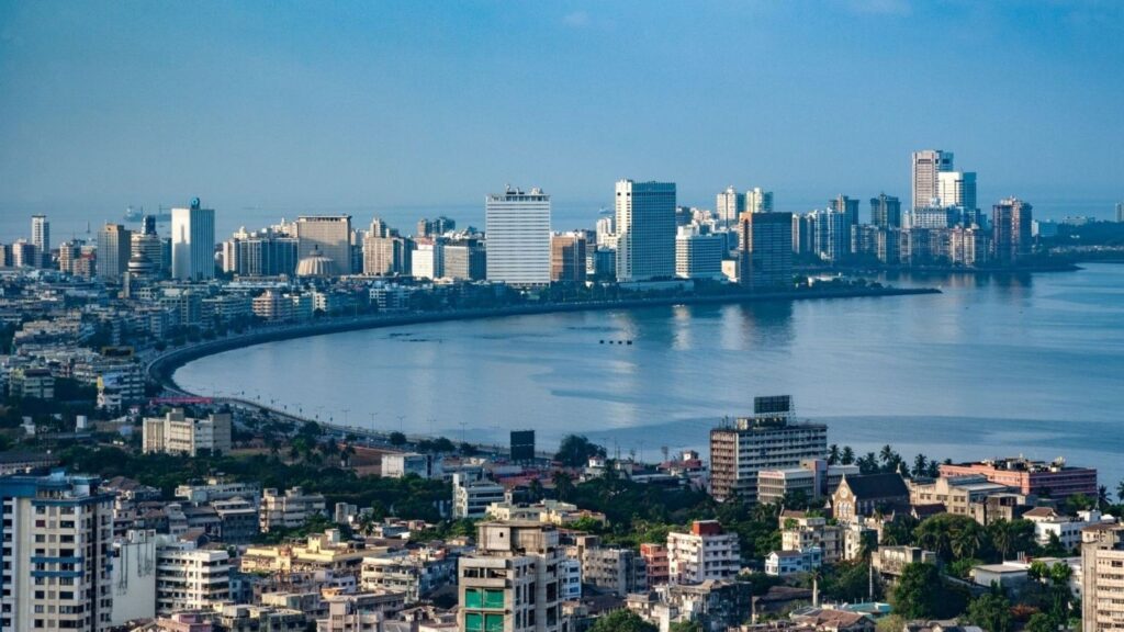 India economy outlook represented by modern business district showing growth sectors and investment opportunities