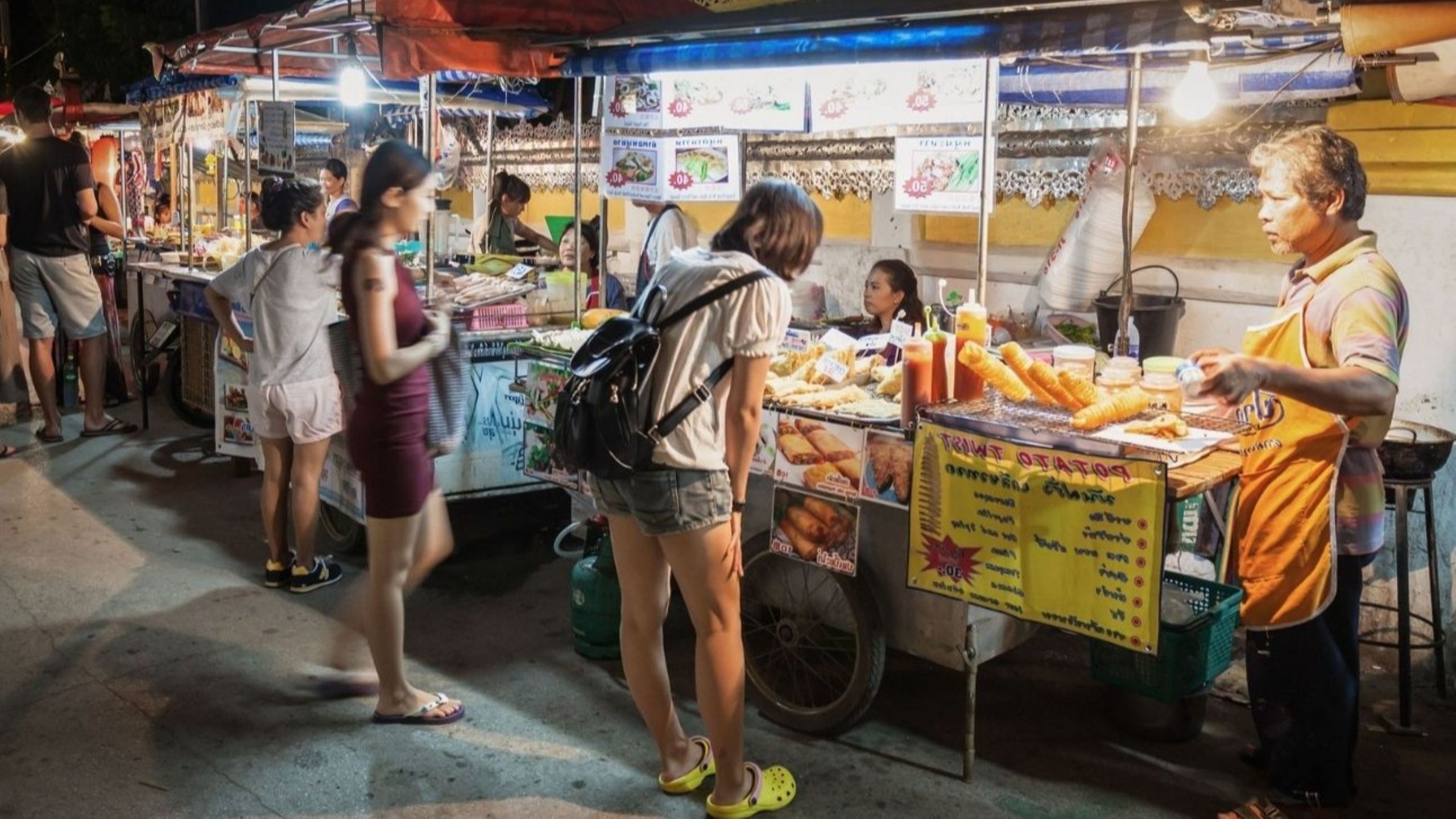 Busy street food stalls in Chandni Chowk Old Delhi one of India's most famous destinations for food travellers