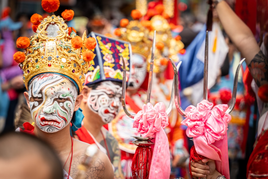 A monk in an ornate mask performs during Hemis Festival in the monastery courtyard in Ladakh