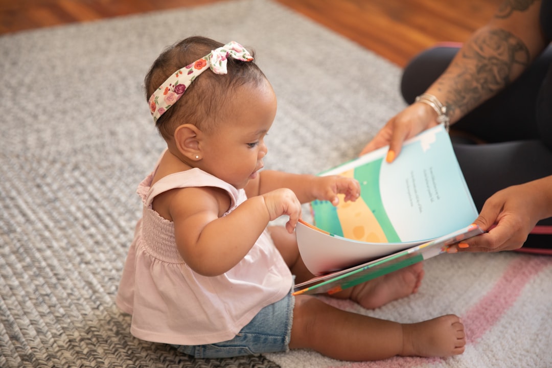 A mother and child reading an Indian mythology book together on the floor at home