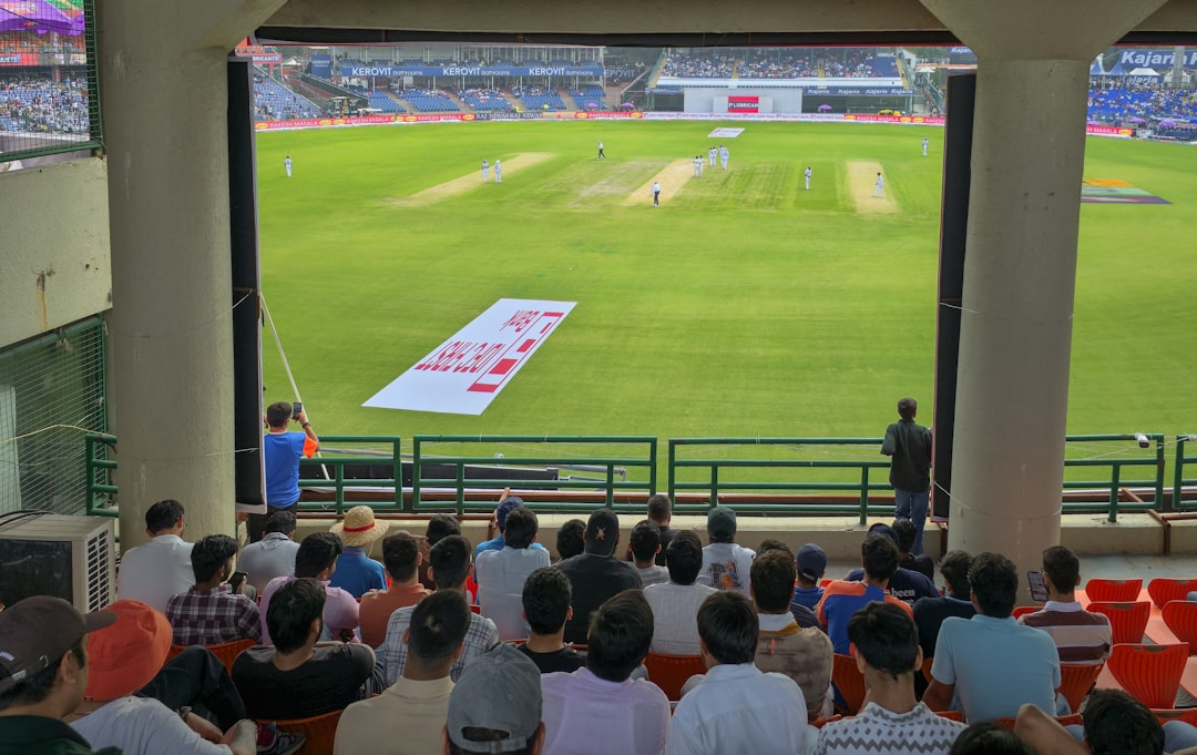 An Indian cricket fan in blue jersey celebrating a boundary during the India vs England ODI series