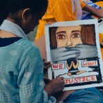 Young Cockroach Janta Party supporters hold signs at a protest in New Delhi demanding exam reform