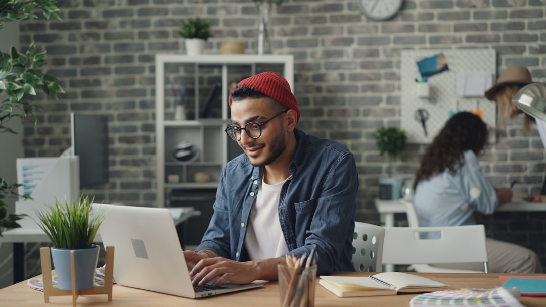 A young entrepreneur works in a co-working space, representing the rise of startup funding in India's tier-2 cities