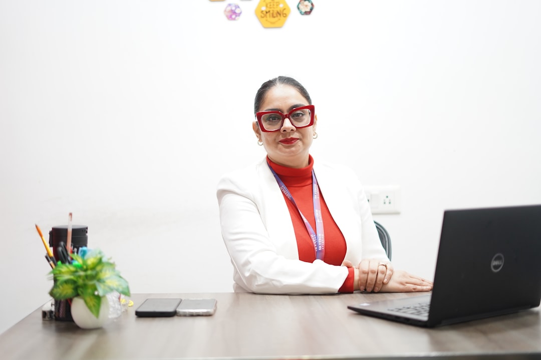 A woman in India reviews her PPF account statements at a desk, planning her long-term savings strategy.