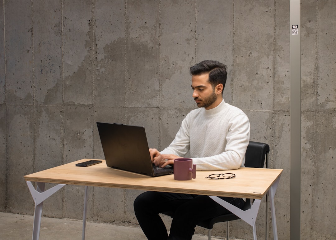 An Indian founder at a desk reviewing revenue data, representing the discipline behind bootstrapped businesses in India