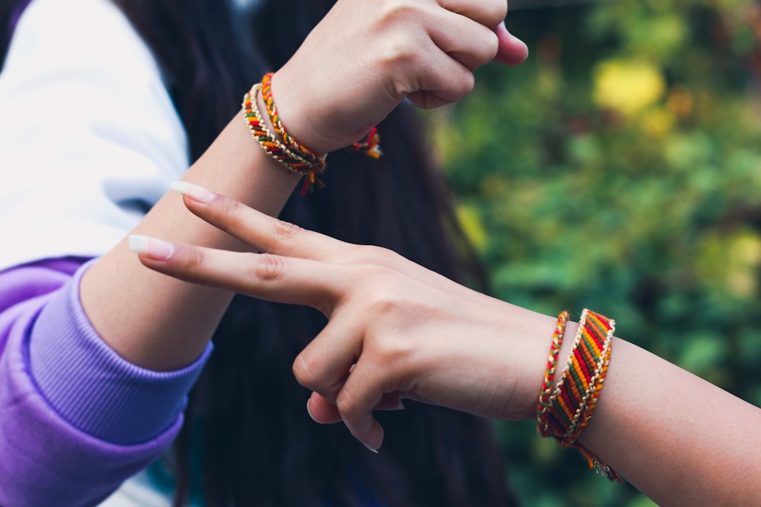 A sister ties a rakhi on her brother's wrist during Raksha Bandhan gifting ceremonies in India