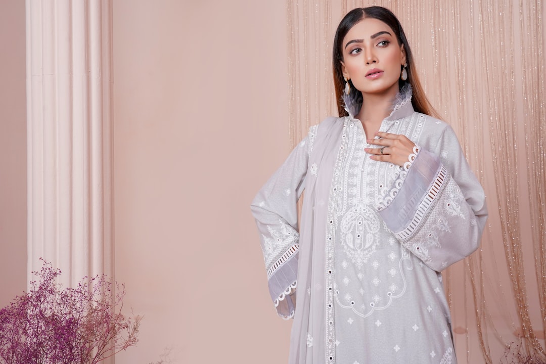 A young Indian woman in a flowy kurta walking confidently, showcasing practical and stylish monsoon outfits