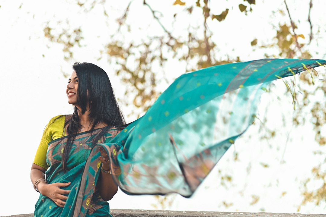 A woman draping a handloom saree at home as part of her festive reset before the celebration season in India