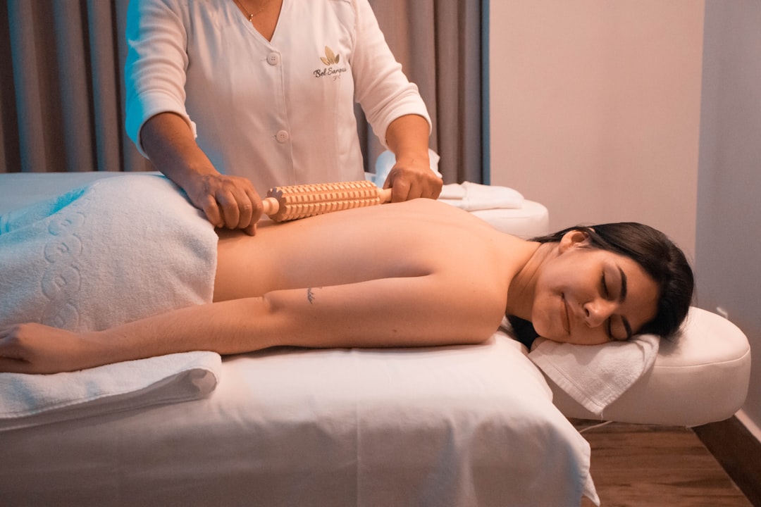A therapist performs a traditional Shirodhara treatment on a guest at one of the heritage Kerala retreats during Onam season