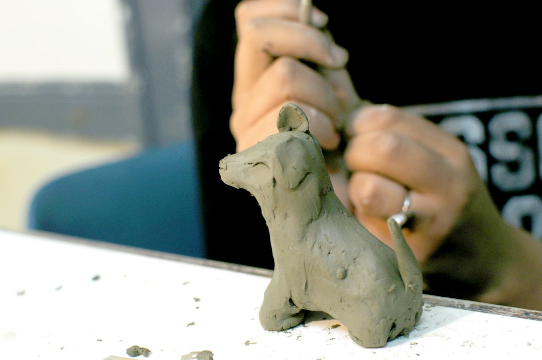 Artisan shaping Bengal terracotta horse in Panchmura workshop
