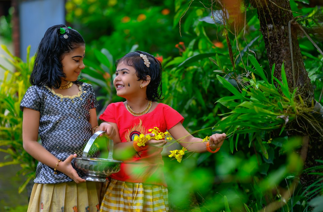 Host welcoming guests outside one of Kerala's backwater homestays